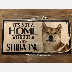 Trskilt med tekst Shiba Inu